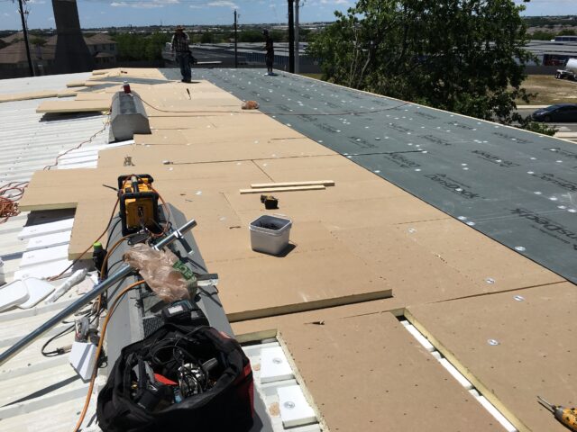 Flat roof being repaired.